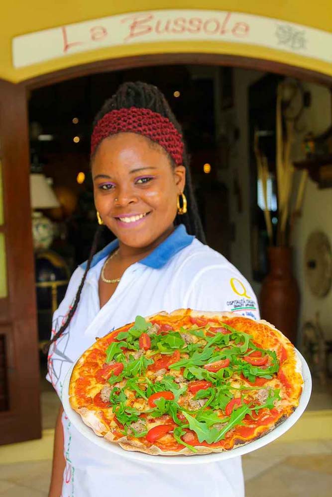La Bussola woman with pizza