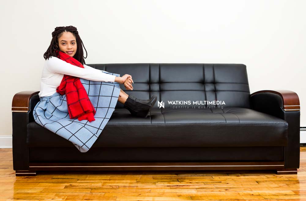 Watkins Multimedia woman on couch